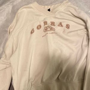 cream colored sweatshirt